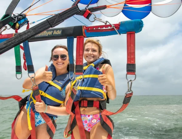 Smiling girls fly with us in Parasailing