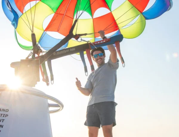 Instructor adjusting the parachute for Parasailing